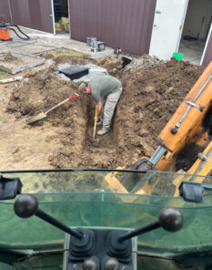 A and D plumber digging trench to lay plumbing