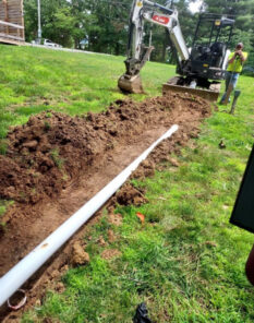 A and D plumber digging trench to lay plumbing