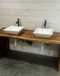 A and D Plumbing installed his and hers sinks on live edge counter