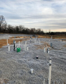 A and D plumbing construction site with plumbing rough-ins in place.