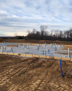 A and D plumbing construction site with plumbing rough-ins in place.