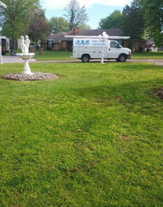 A and D plumbing Trucks outside customers home.