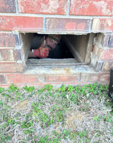 A and D plumber giving a thumbs up from a customer basement window